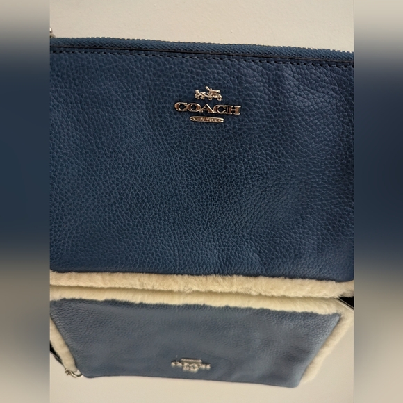 Coach Handbags - ‼️PRICE DROP‼️⭐Coach⭐ Blue Wristlet with Shearling Trim